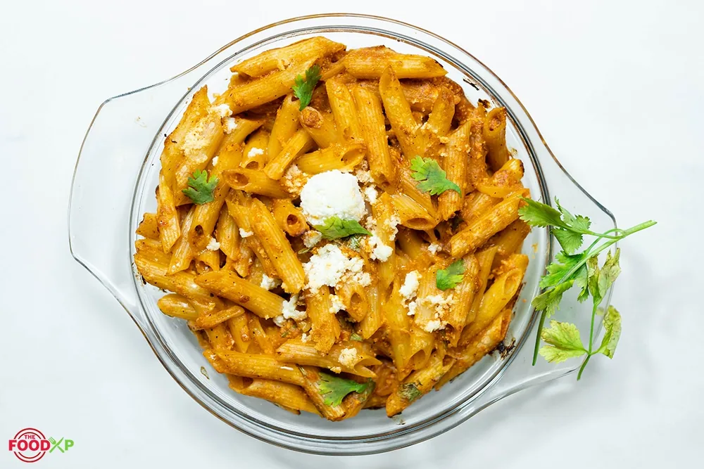 Cheesecake Factory style four cheese pasta topped with basil, developed by Chef Jasbir Singh